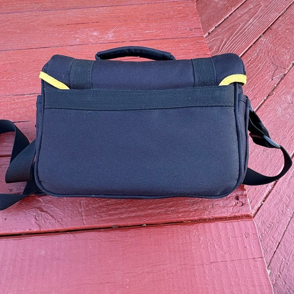Nikon black camera and accessory shoulder carrying bag